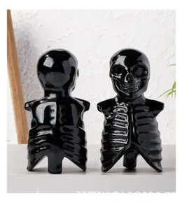 Detailed view of black obsidian skull skeleton crystal carving, perfect Halloween desktop decor.