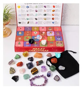 Crystal advent calendar detail showing raw rough stones, black pouch and gemstone list.