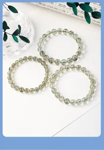 Natural green rutilated quartz bead bracelet crystal gemstone jewelry for men and women detail view