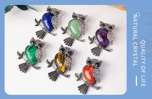 Detail view of colorful crystal owl pendant necklace, retro silver finish, natural gemstone jewelry.