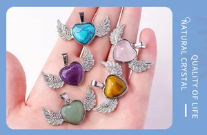 Natural crystal heart angel wings pendant detail showing multi-color gemstone necklace.
