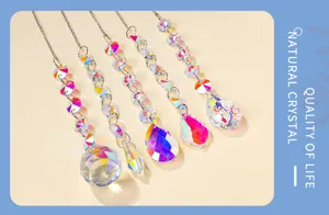 Detailed close-up view of vibrant crystal suncatcher prisms hanging with sparkling rainbow reflections.