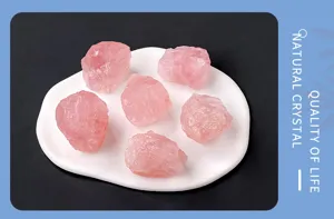Raw rose quartz crystal stones detail shot, natural pink crystal mineral specimen for aromatherapy.