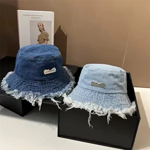 Washed denim bucket hat for women, distressed frayed edge sun protection casual cap.