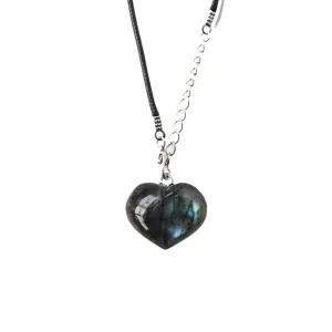 Detailed view of a natural labradorite heart pendant necklace with black cord and chain.