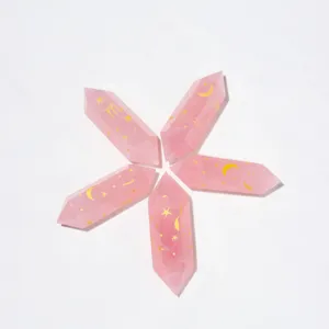 Natural rose quartz crystal double terminated wands with gold engraved zodiac symbols.