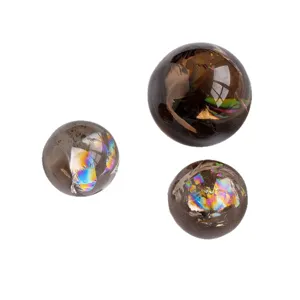 Boule de cristal en quartz fumé naturel avec inclusions arc-en-ciel pour décoration feng shui.