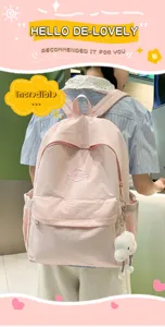 Casual pink school backpack for women and girls, lightweight travel daypack with cute fluffy pendant.