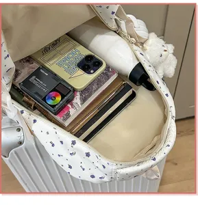 Detailed interior view of floral student backpack, showing large storage capacity and cute styling.