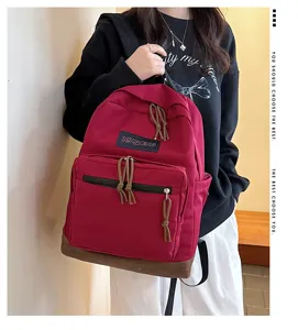 Casual canvas backpack with contrasting suede bottom, front pocket and stylish design.