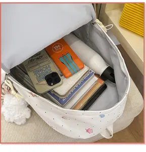 Detailed interior view of cute printed school backpack with spacious capacity and books.