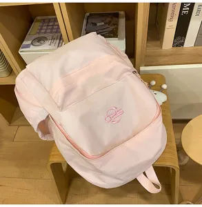 Pink casual campus school backpack detail view, lightweight student travel bookbag with embroidery.