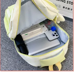Detailed view of large capacity aesthetic student backpack interior storage layout.