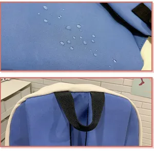Close-up detail view of the waterproof blue backpack featuring durable fabric and sturdy handle.