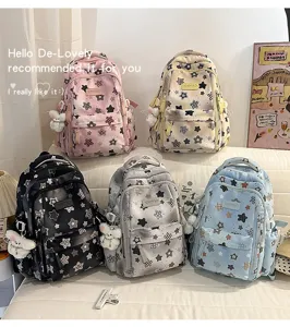 Detailed view of multi-color star print casual backpacks featuring cute bear pendants for daily use.
