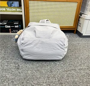 Detail view of the grey casual nylon backpack, large capacity minimalist school bag for commute.