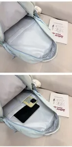 Large capacity student school backpack interior detail view, light blue durable nylon bookbag.