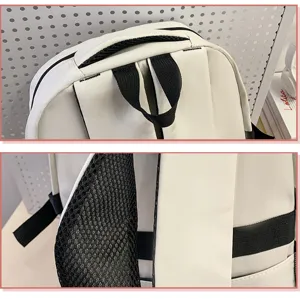 White student backpack detail view showing shoulder straps and handle construction clearly.