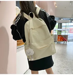 Casual canvas backpack with cute cloud pendant, lightweight travel school bag for students.