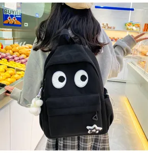 Cute black corduroy backpack with big eyes design, casual large capacity school bag for women.