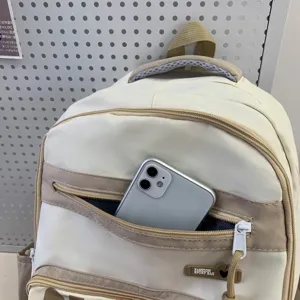 Casual canvas backpack with front zipper pocket, beige and khaki stylish school bag.