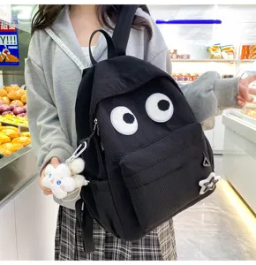 Black corduroy backpack with cute big eyes design, large capacity student casual school bag.
