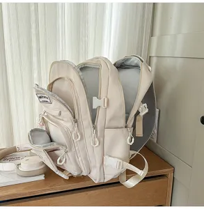 Backpack detail view, multi-compartment design, large capacity for daily travel and school use.