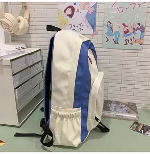 Color-block canvas student backpack with spacious compartments for daily school and casual use.