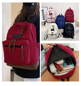 Casual canvas backpack for students, stylish travel school bag with large capacity and multi pockets.