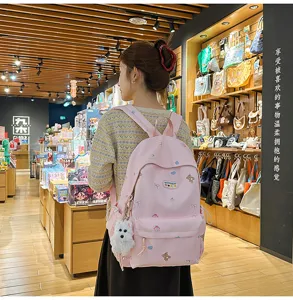 Cute pink canvas school backpack for teen girls, large capacity casual daypack with bear print.