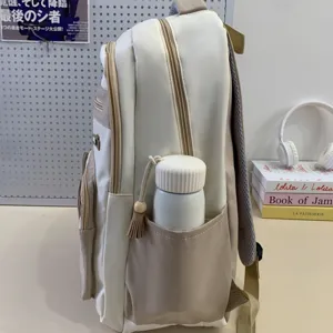 Casual minimalist canvas school backpack with side pocket and cute aesthetic design details.