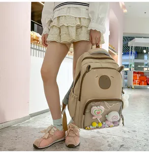 Large capacity canvas school backpack with cute bear ears and clear front pocket design.