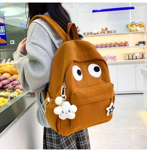 Cute corduroy backpack with big eyes design, large capacity casual school bag for women girls.
