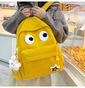 Cute yellow corduroy backpack with big eyes, casual large capacity student daily schoolbag.