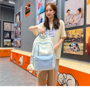 Cute college student backpack in color block design with star pattern, large capacity casual bag.