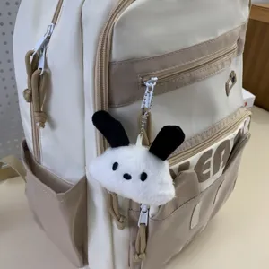 Cute Japanese style casual backpack with cartoon plush pendant, lightweight daily school bag.