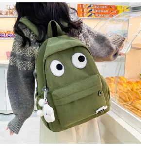 Cute corduroy backpack with big eyes for women, stylish student school bag casual daypack.
