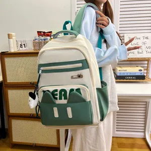 Cute Japanese style cat ear backpack student casual daypack green and beige nylon school bag detail.