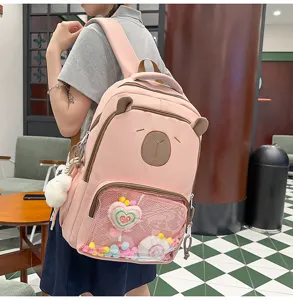 Detail shot of pink cute bear style backpack with clear front pocket, ideal for daily campus use.