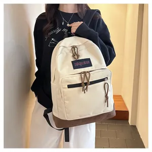 Casual canvas backpack for students, stylish school bag with laptop compartment and brown base.