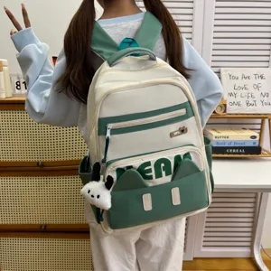 Casual Japanese style student backpack with cute cat ears and plush pendant, white green design.