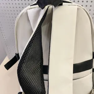 Detail view of student backpack back straps, breathable mesh design, casual everyday school bag.