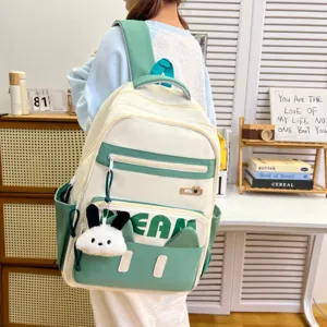 Japanese style fresh casual backpack with cute bunny pendant, minimalist green student bookbag.