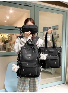 Black student backpack set with tote bag and pouch, cute bow design, large capacity for daily use.