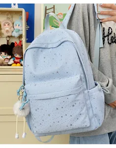 Cute light blue star pattern backpack detail view showing front pockets and fluffy plush charm.