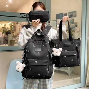 Black student backpack set large capacity school bag with cute bow pattern for daily travel.