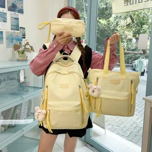 Yellow student school backpack set with tote bag and pencil case for daily commute travel.