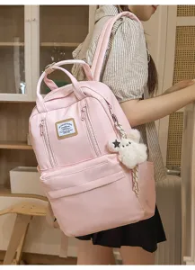 Pink Japanese style casual backpack for school and travel with large capacity and cute plush.