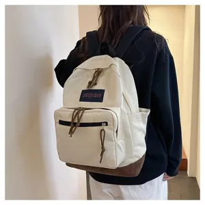 Casual canvas backpack for men and women, stylish travel school bag with contrast bottom.