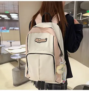 Casual canvas backpack with chic pink and white color block design, perfect for daily use.